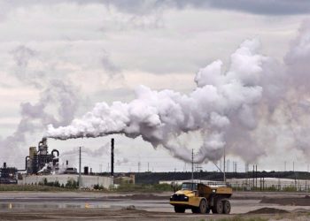 Deloitte says that without reduction in oil and gas output, an emissions cap is not feasible.