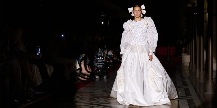 Chanel presents haute couture apparel at the Opera theater in Paris.